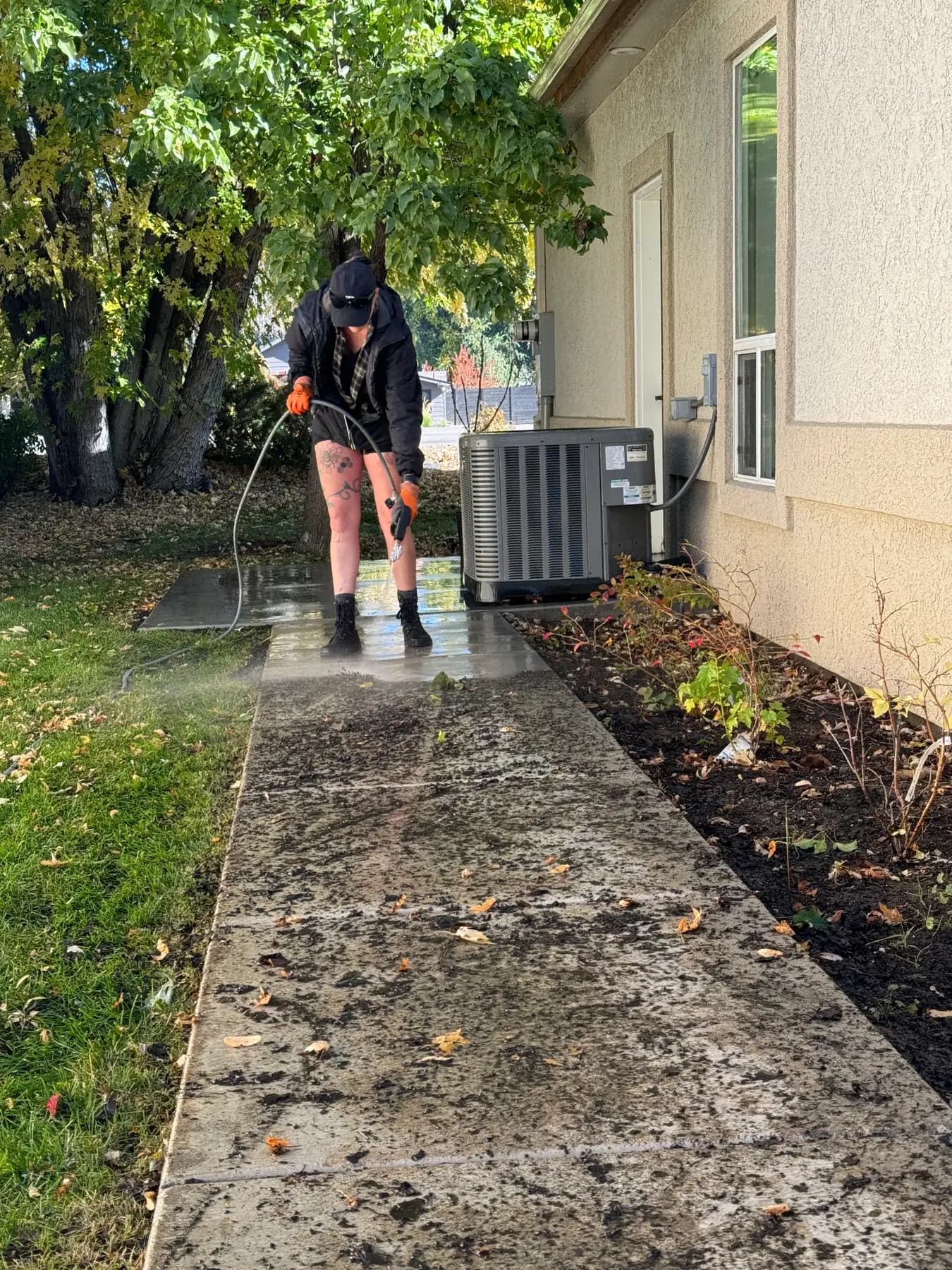 Sidewalk pressure washing in progress in Boise