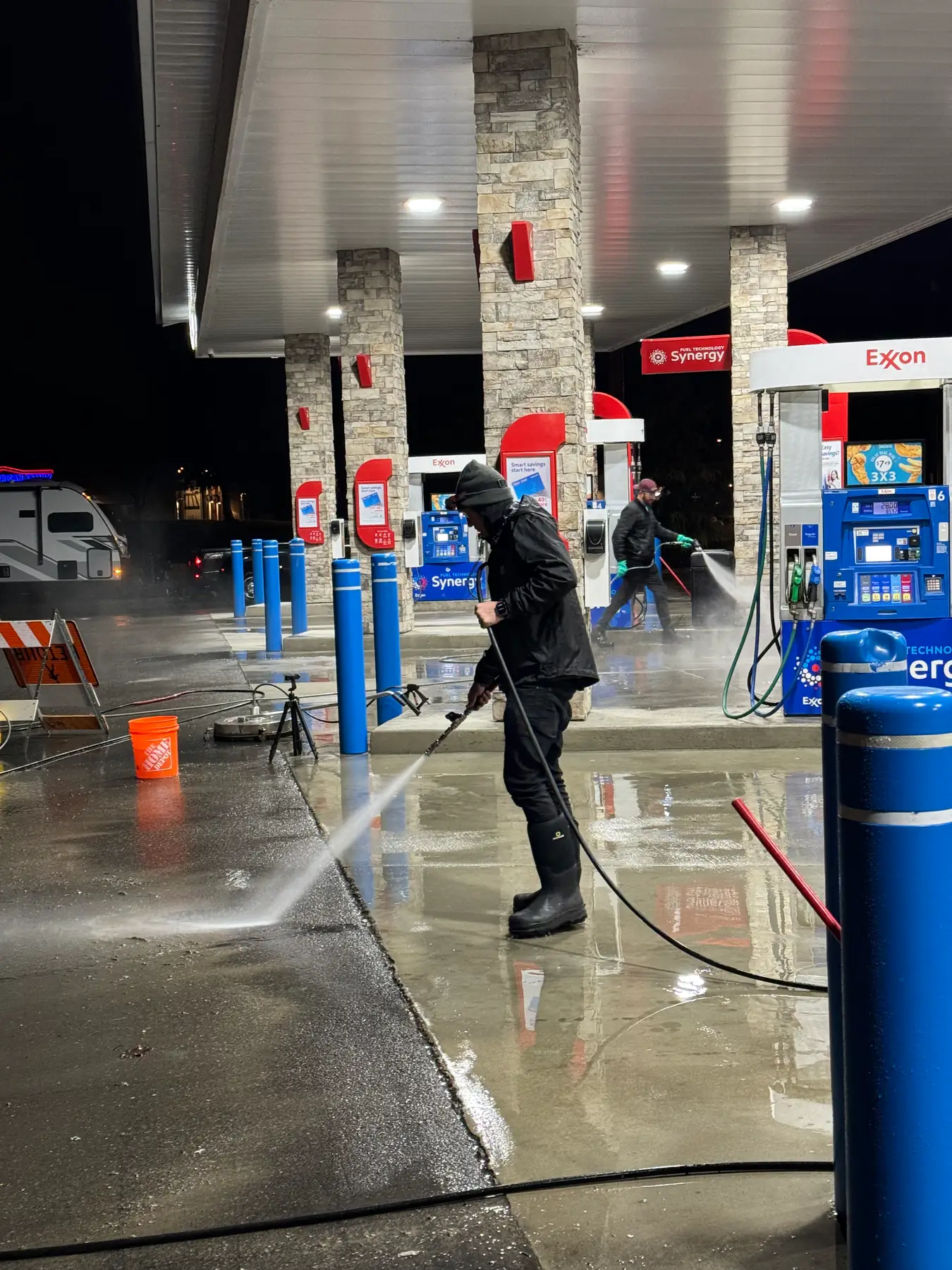 Night concrete cleaning at a gas station by Sol team