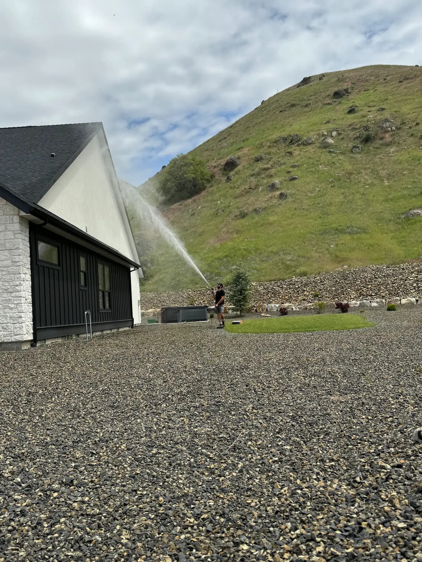 Exterior house rinse with high reach sprayer in Boise