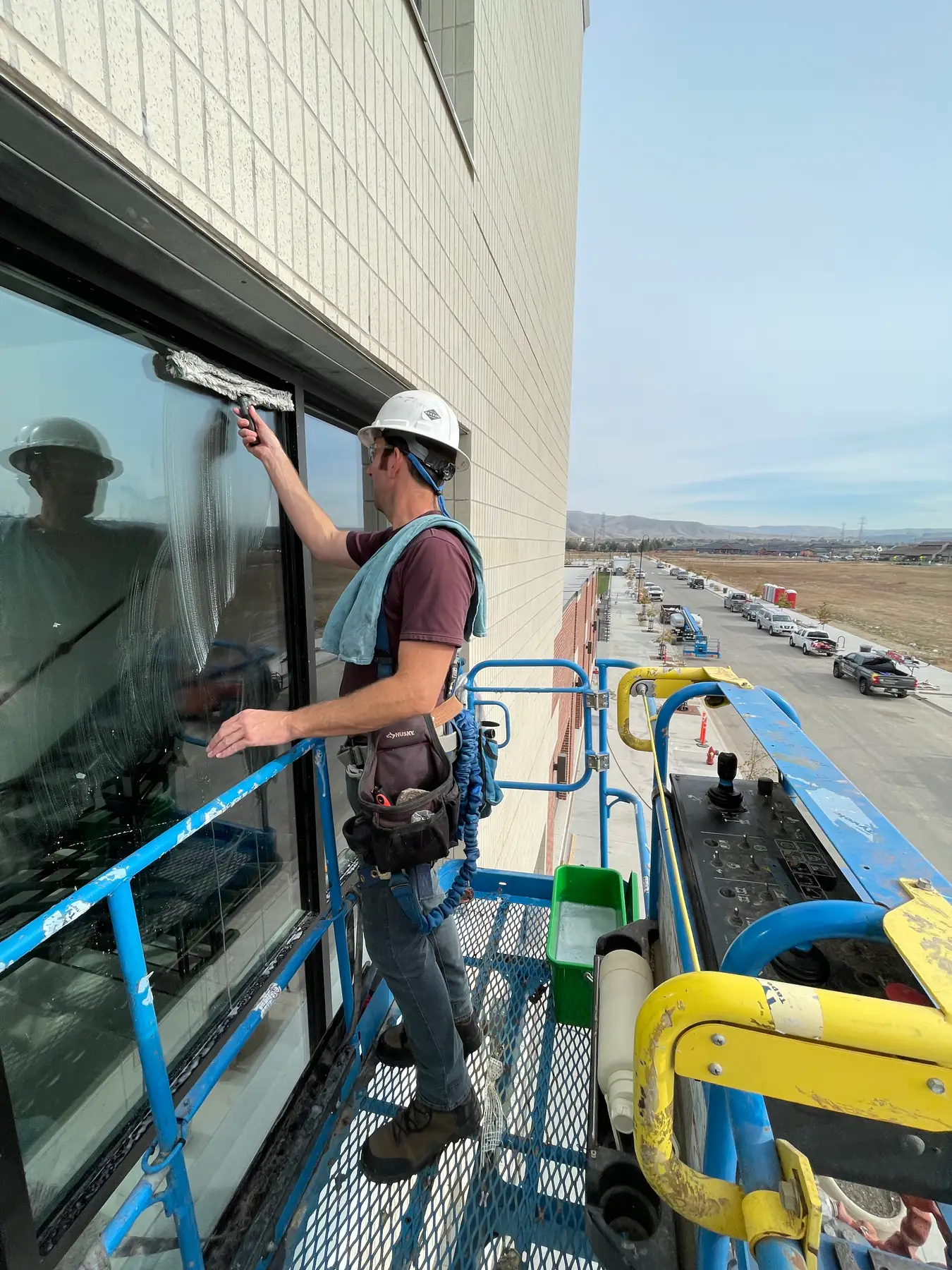High-rise exterior window cleaning from lift — Boise