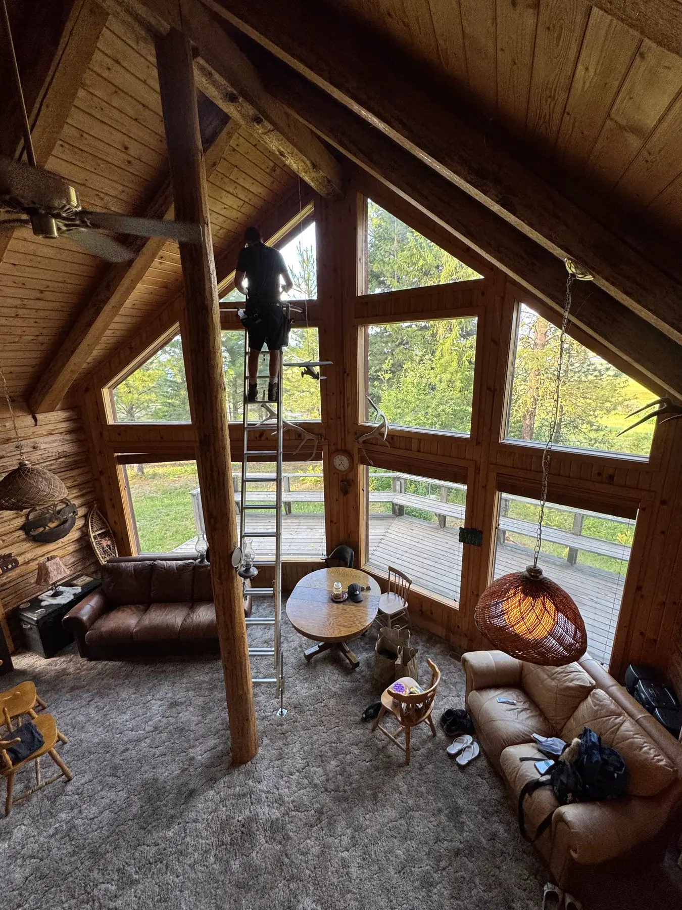 Interior vaulted cabin glass cleaning with ladder